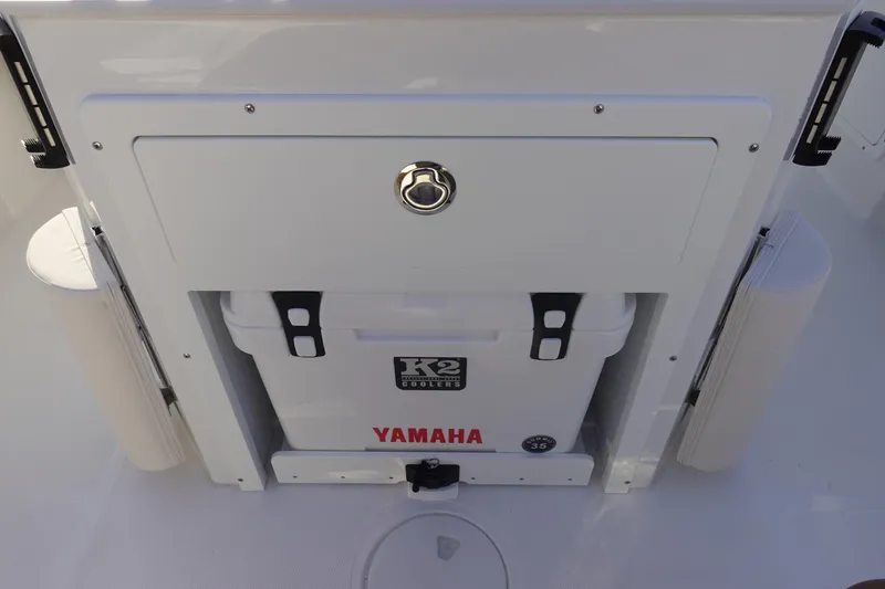 Slide: The Image of 2026 Sea Hunt Ultra 275 SE boat with K2 cooler and Yamaha branding. - 13