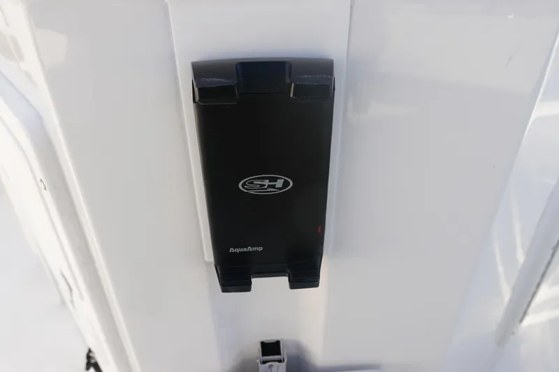 Slide: The Image of 2026 Sea Hunt Ultra 275 SE AquaAmp device on white boat surface. - 14
