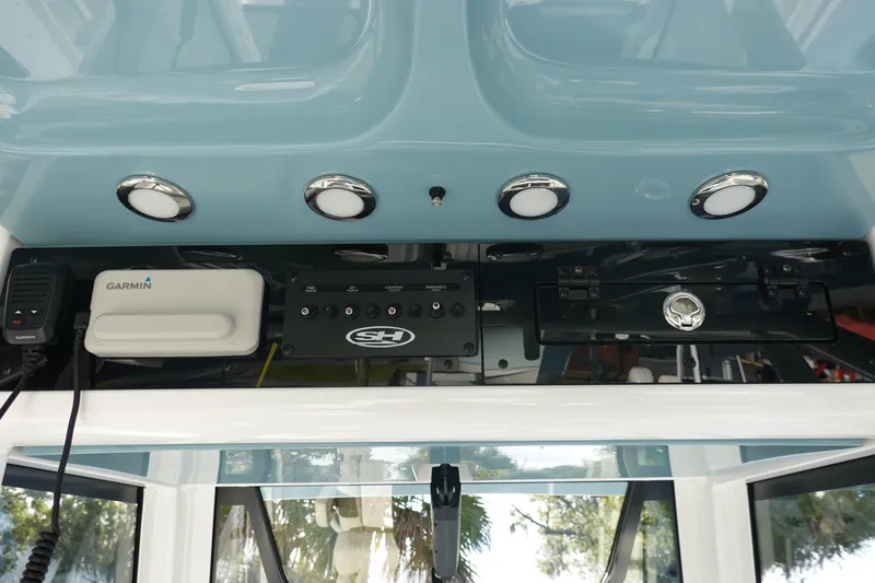 Slide: The Image of 2026 Sea Hunt Ultra 275 SE dashboard with Garmin electronics and control panel. - 17