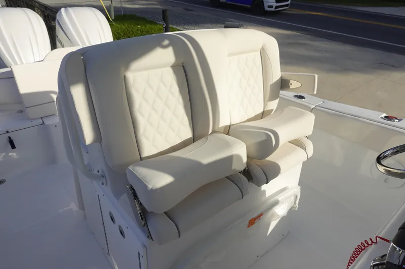 Slide: The Image of 2026 Sea Hunt Ultra 275 SE boat with luxurious white seating. - 19