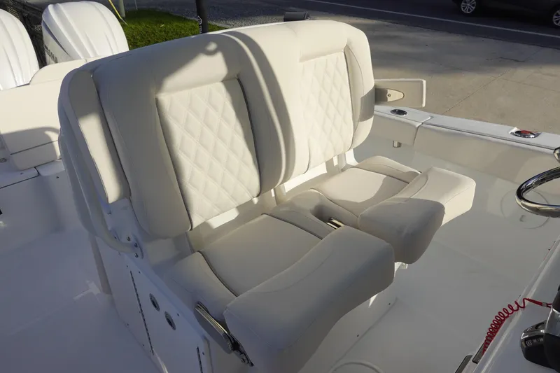 Slide: The Image of 2026 Sea Hunt Ultra 275 SE boat with luxurious white seating and modern design. - 20