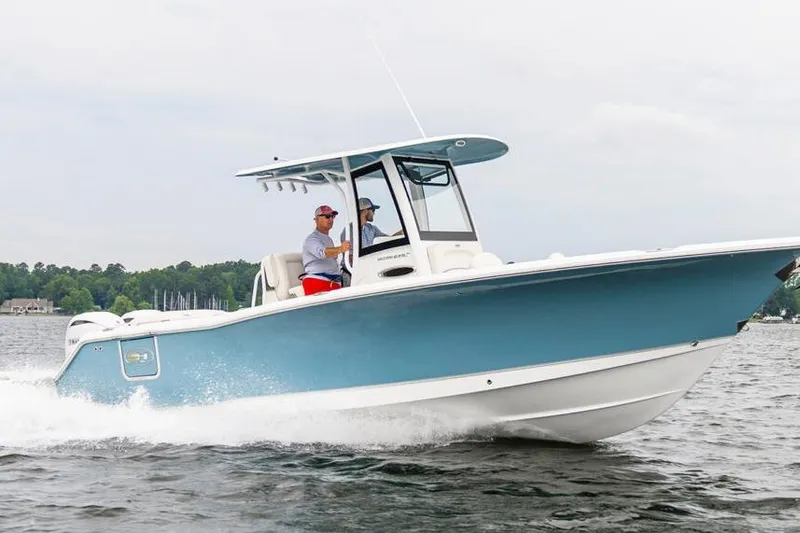 Slide: The Image of 2026 Sea Hunt Ultra 275 SE boat on trailer, parked outdoors. - 3