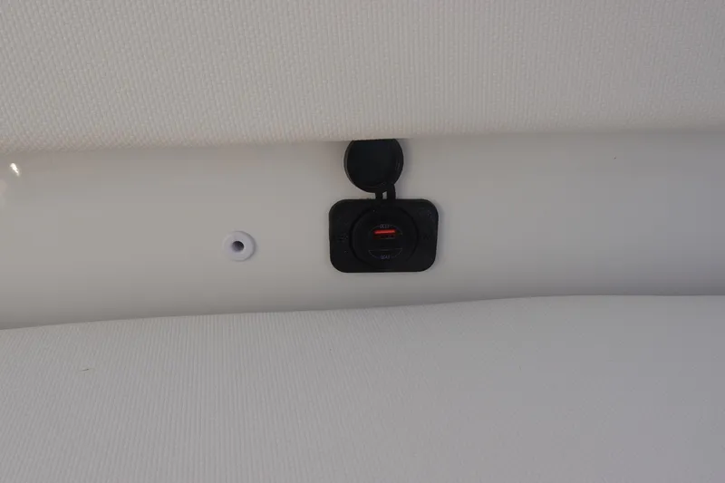 Slide: The Image of USB charging port on 2026 Sea Hunt Ultra 275 SE boat interior. - 30