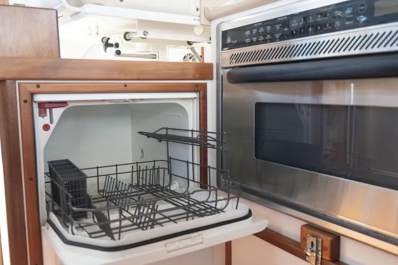 Slide: The Image of Compact dishwasher and oven in 2005 Mast & Mallet Thomas Point boat kitchen. - 12