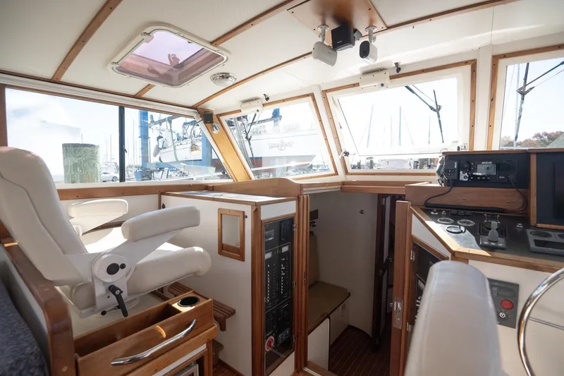 Slide: The Image of Interior of 2005 Mast & Mallet Thomas Point boat with helm and navigation equipment. - 18