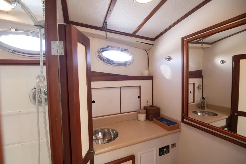 Slide: The Image of Luxurious 2005 Mast & Mallet Thomas Point yacht bathroom with elegant wood accents. - 27