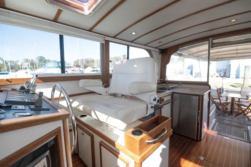 Slide: The Image of Interior of 2005 Mast & Mallet Thomas Point boat with helm and seating area. - 29