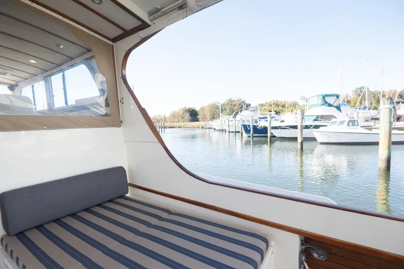 Slide: The Image of Interior view of 2005 Mast & Mallet Thomas Point boat with marina backdrop. - 38