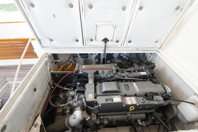 Slide: The Image of Engine compartment of 2005 Mast & Mallet Thomas Point boat, showcasing detailed mechanical components. - 40