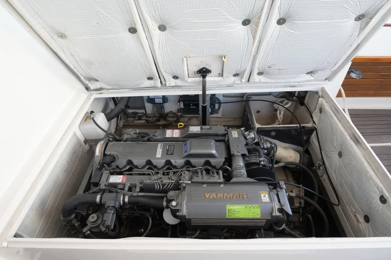 Slide: The Image of Engine compartment of a 2005 Mast & Mallet Thomas Point boat, featuring a Yanmar engine. - 41