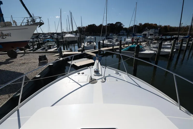 Slide: The Image of Bow view of 2005 Mast & Mallet Thomas Point boat docked in a marina. - 44