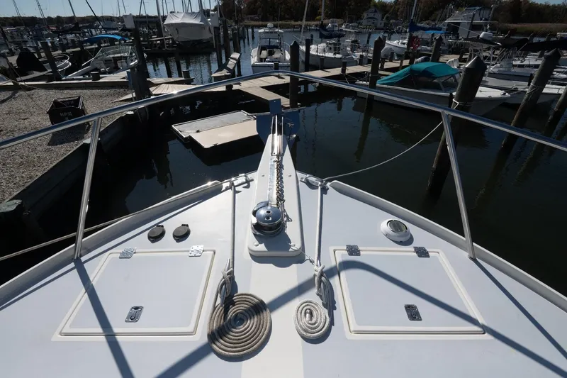 Slide: The Image of Bow view of 2005 Mast & Mallet Thomas Point boat docked at marina. - 47