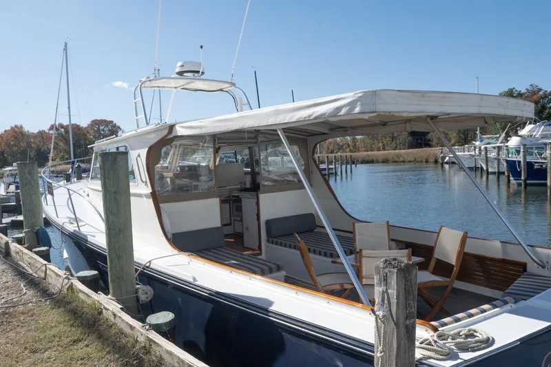 Slide: The Image of 2005 Mast & Mallet Thomas Point boat docked by the water on a sunny day. - 55