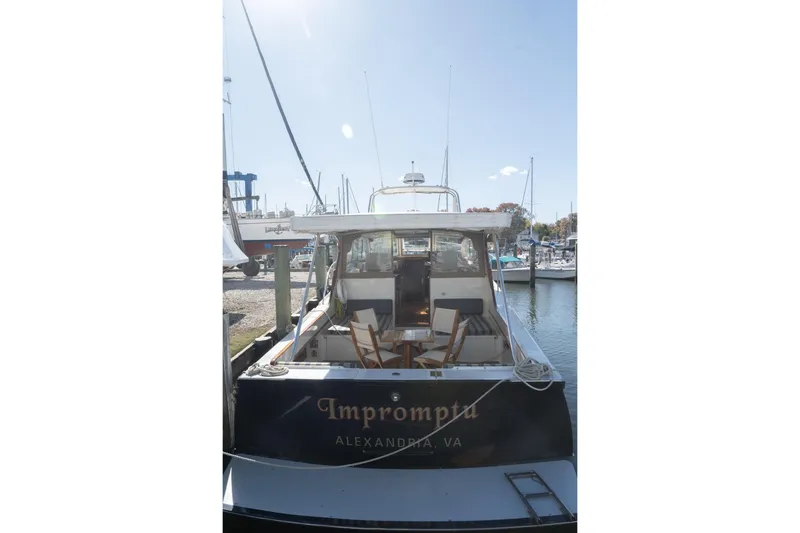 Slide: The Image of 2005 Mast & Mallet Thomas Point boat docked, named "Imprompta," in Alexandria, VA marina. - 57