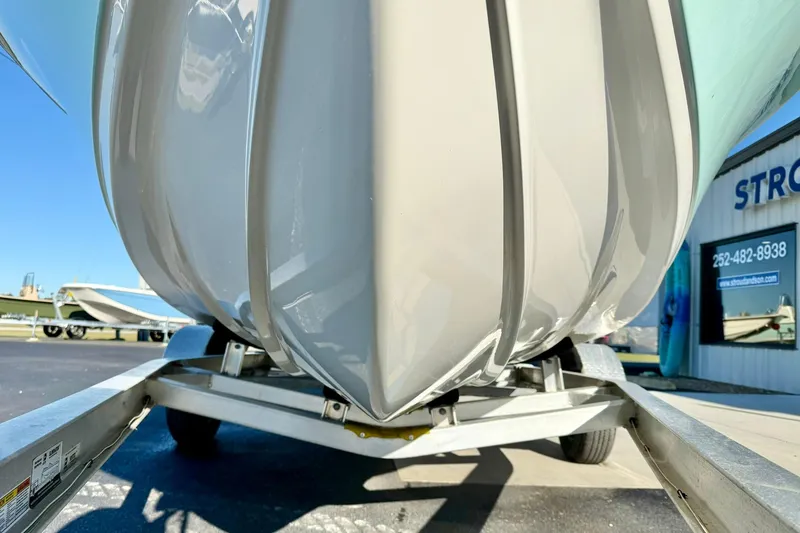 Slide: The Image of 2023 Key West 188 Bay Reef boat on trailer, close-up view of hull design. - 10