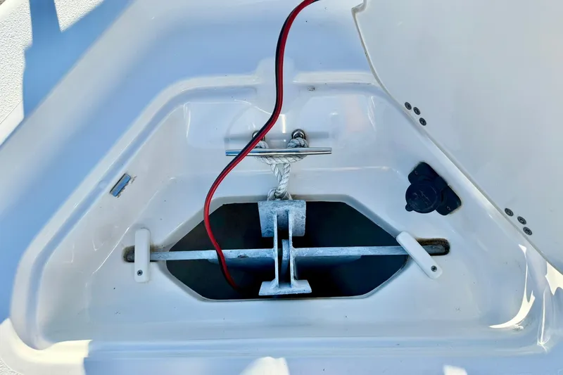 Slide: The Image of Anchor compartment of 2023 Key West 188 Bay Reef boat with red cable. - 13