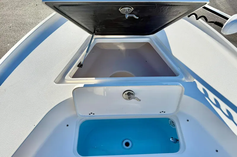 Slide: The Image of 2023 Key West 188 Bay Reef boat storage compartments, open and ready for use. - 14