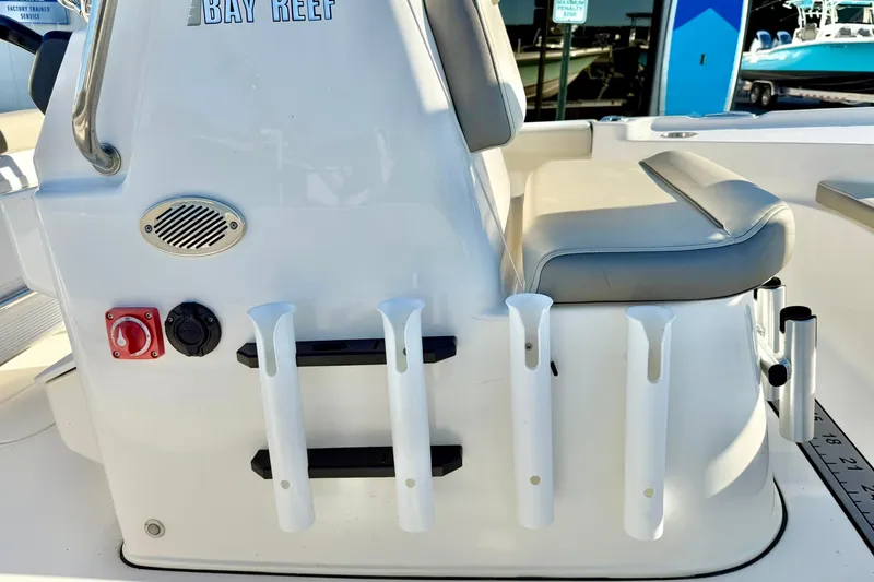 Slide: The Image of 2023 Key West 188 Bay Reef boat interior with rod holders and seating. - 21
