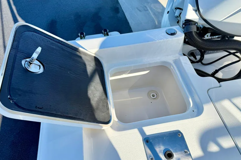 Slide: The Image of 2023 Key West 188 Bay Reef boat storage compartment with open lid. - 32