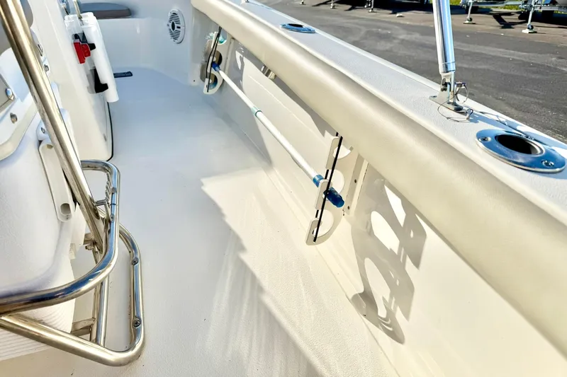 Slide: The Image of 2023 Key West 188 Bay Reef boat interior with stainless steel fittings and rod holders. - 34