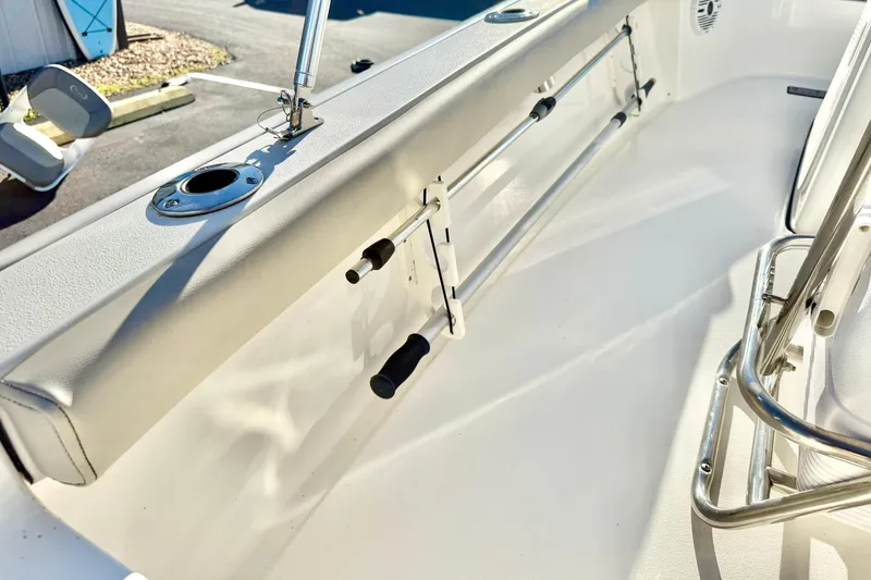 Slide: The Image of 2023 Key West 188 Bay Reef boat interior with rod holders and seating. - 35