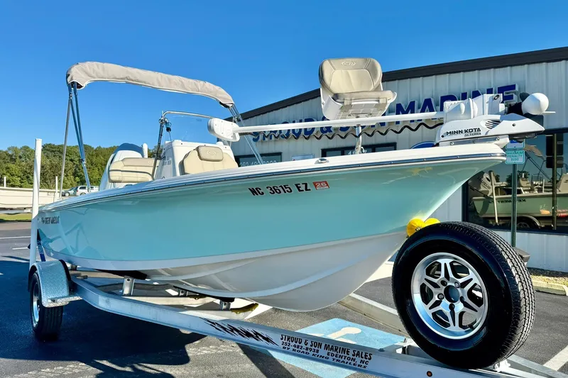Slide: The Image of 2023 Key West 188 Bay Reef boat on trailer, displayed outdoors at a marine dealership. - 7