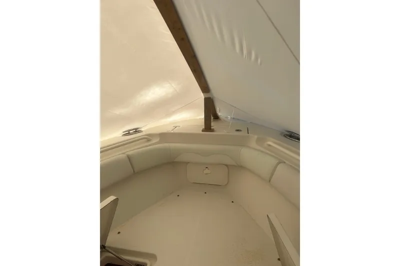 Slide: The Image of Open storage compartment on 2015 Sailfish 290 CC boat, containing fishing gear. - 24