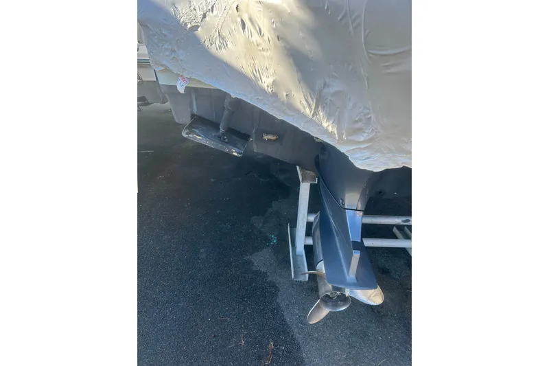 Slide: The Image of Covered 2015 Sailfish 290 CC boat on trailer, parked outdoors. - 27