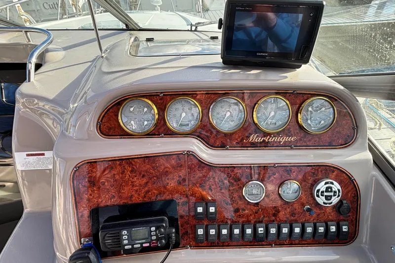 Slide: The Image of 2001 Wellcraft 2800 Martinique interior with white seating and striped pillow. - 11