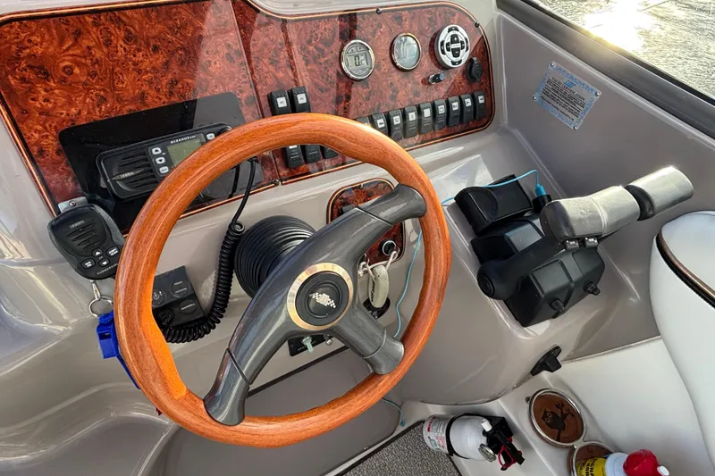 Slide: The Image of Dashboard of 2001 Wellcraft 2800 Martinique boat with gauges and Garmin GPS. - 12