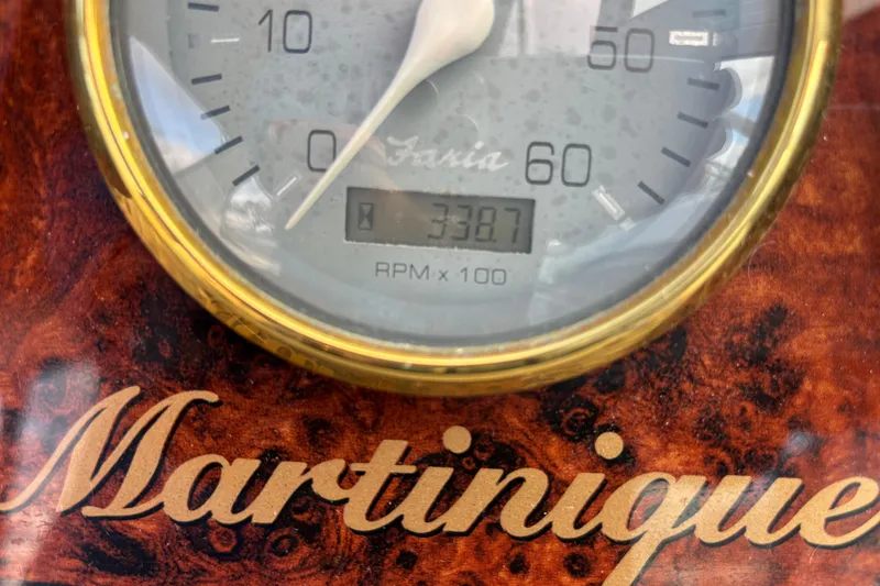 Slide: The Image of 2001 Wellcraft 2800 Martinique helm with wood accents and navigation controls. - 14