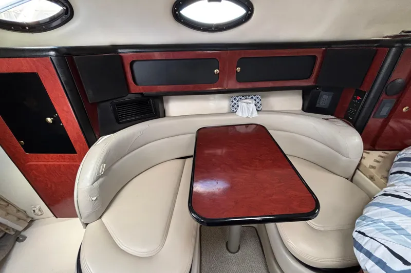 Slide: The Image of Interior cabin of 2001 Wellcraft 2800 Martinique with bed and patterned bedding. - 17