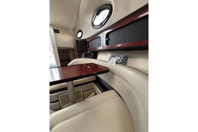 Slide: The Image of 2001 Wellcraft 2800 Martinique cabin interior with kitchenette, sink, and mounted TV. - 19