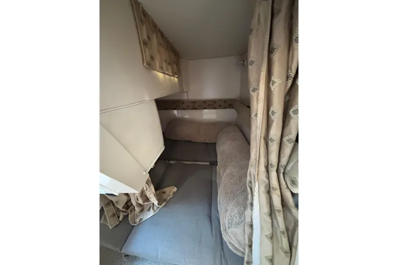 Slide: The Image of Interior of 2001 Wellcraft 2800 Martinique boat with steps and seating area. - 21