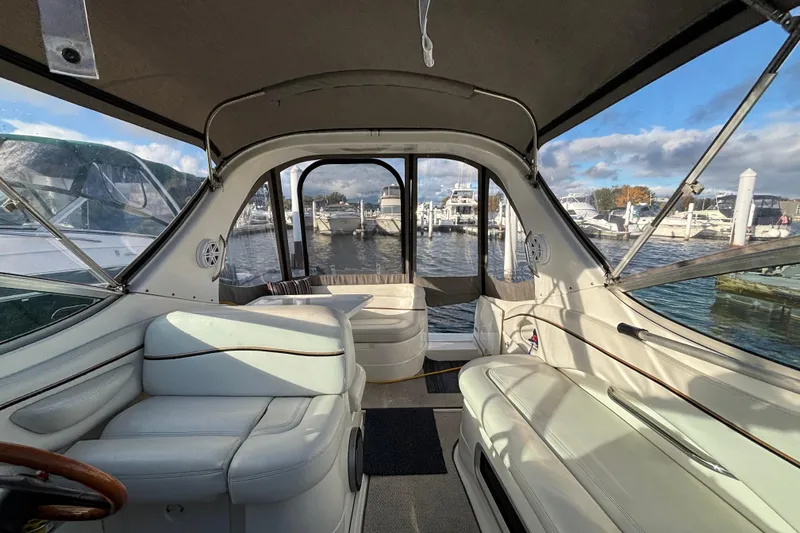 Slide: The Image of 2001 Wellcraft 2800 Martinique boat bathroom with sink, toilet, and storage cabinet. - 23