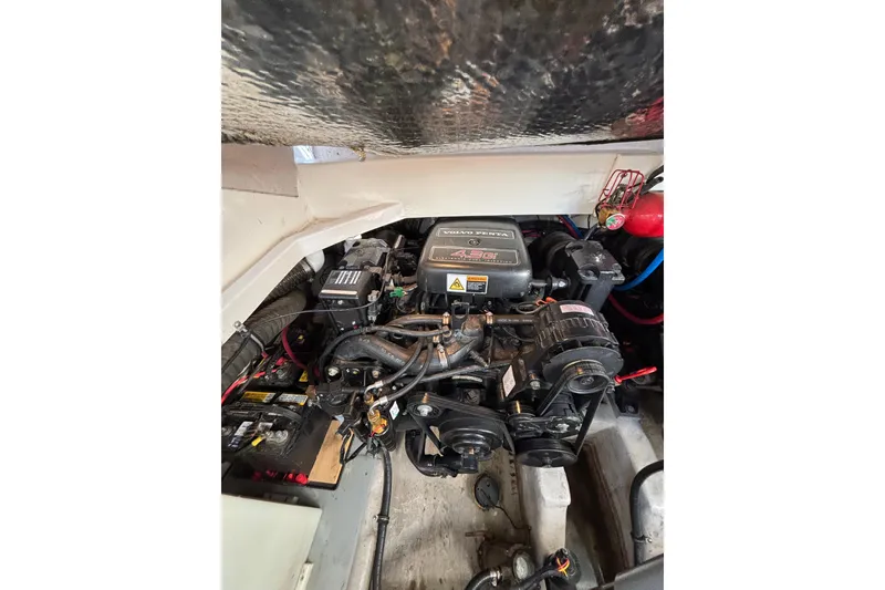 Slide: The Image of Engine compartment of a 2001 Wellcraft 2800 Martinique boat, featuring a Volvo Penta engine. - 26