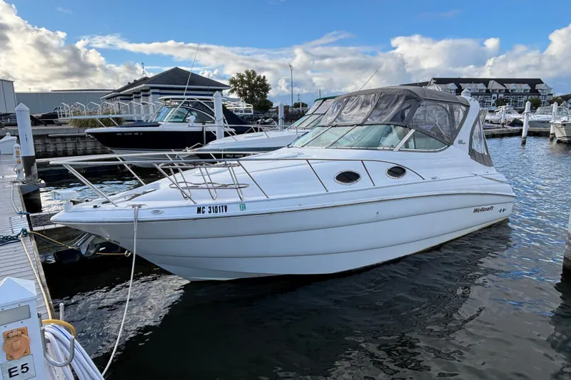 Slide: The Image of Interior of 2001 Wellcraft 2800 Martinique boat with seating and table. - 3