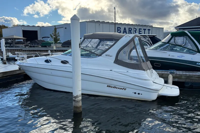 Slide: The Image of Interior view of 2001 Wellcraft 2800 Martinique boat docked at marina. - 4