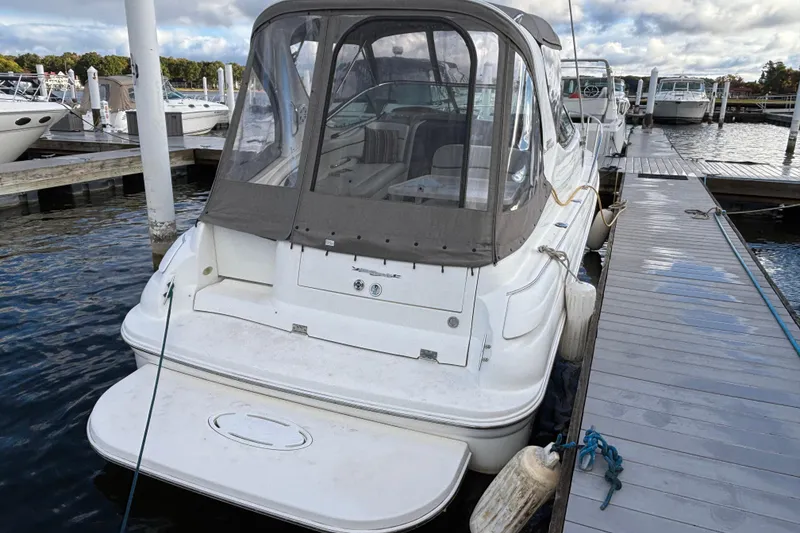 Slide: The Image of 2001 Wellcraft 2800 Martinique boat docked at marina under cloudy sky. - 6