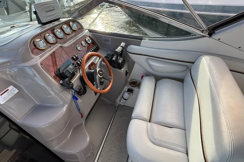 Slide: The Image of 2001 Wellcraft 2800 Martinique boat docked at marina under cloudy sky. - 8