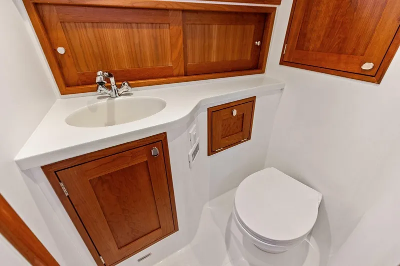 Slide: The Image of 2025 MJM 35 yacht bathroom with wooden cabinets and modern fixtures. - 11