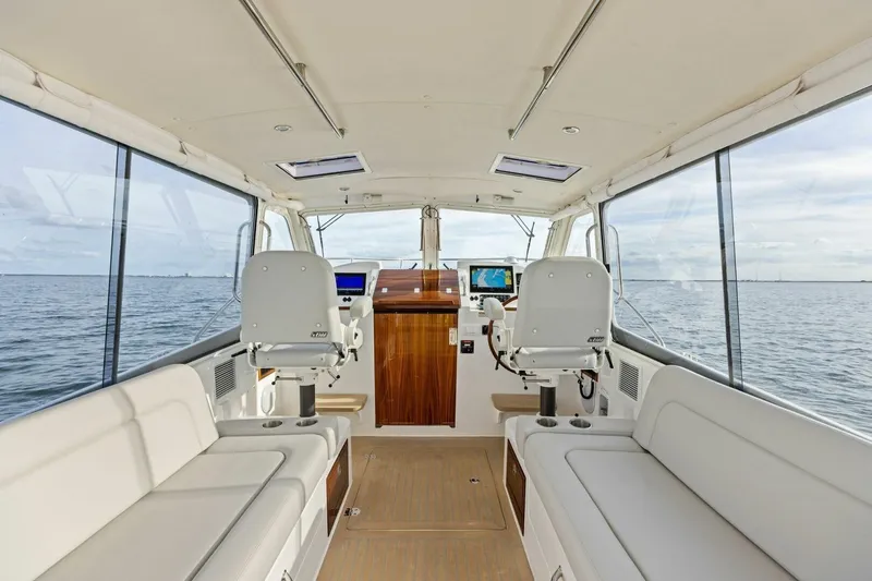 Slide: The Image of Interior of 2025 MJM 35 boat with modern seating and navigation equipment. - 13