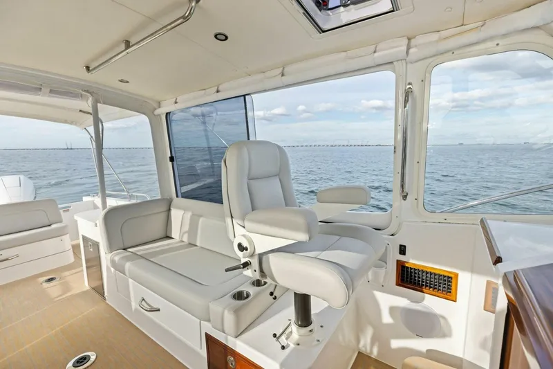 Slide: The Image of Luxurious interior of 2025 MJM 35 yacht with ocean view and comfortable seating. - 19