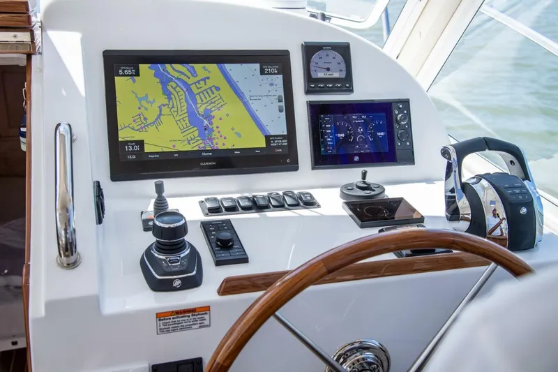 Slide: The Image of Luxurious 2025 MJM 35 boat interior with sleek seating and ocean view. - 2