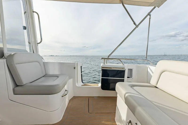Slide: The Image of 2025 MJM 35 boat interior with comfortable seating and ocean view. - 25