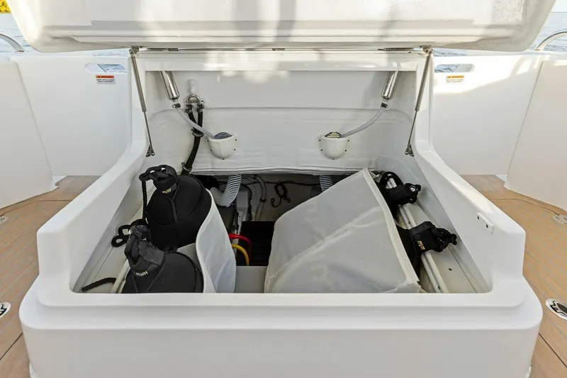 Slide: The Image of Storage compartment on 2025 MJM 35 boat with scuba gear and equipment. - 30