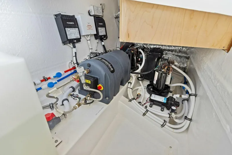 Slide: The Image of Engine room of 2025 MJM 35 boat with complex piping and machinery. - 34
