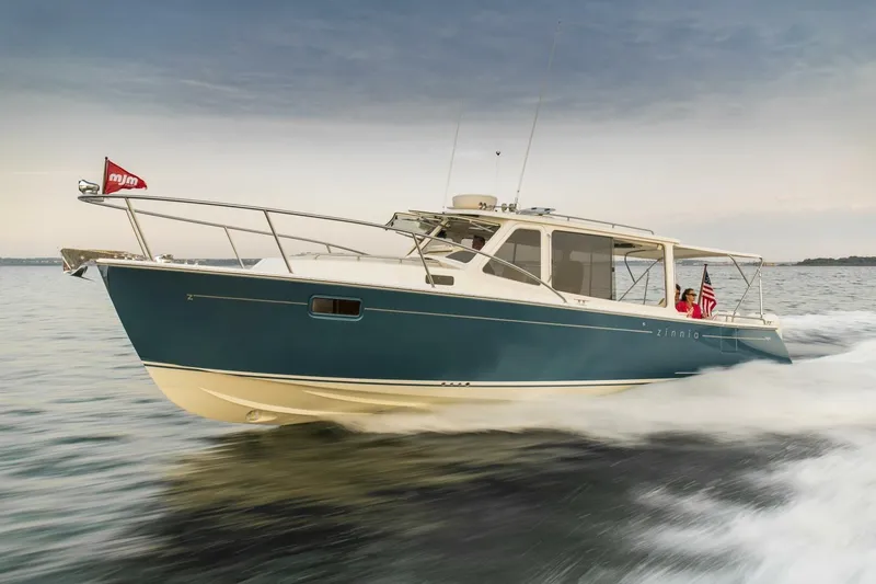 Slide: The Image of Modern galley kitchen in 2025 MJM 35 boat with wood accents and sleek appliances. - 8