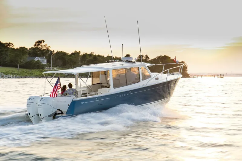 Slide: The Image of 2025 MJM 35 yacht interior with wooden cabinetry and storage compartment. - 9