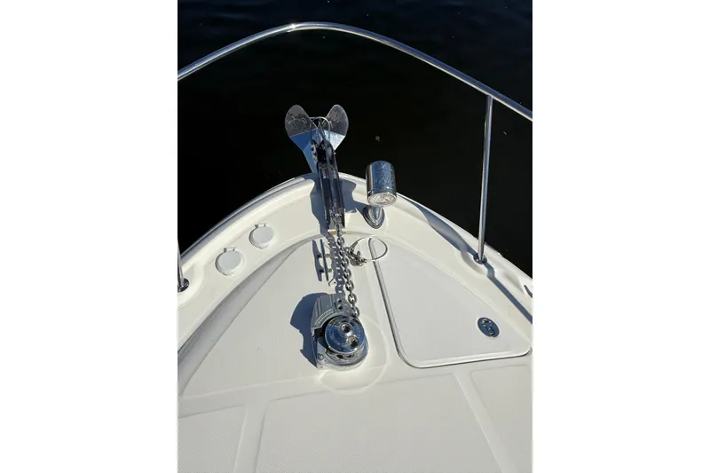 Slide: The Image of Bow of 2003 Sea Ray 320 Sundancer with anchor and chain in sunlight. - 12